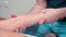 Osteopathic orthopedist makes massage therapy for restoring the arm of the hand after an injury. Physiotherapy of a