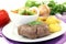 Ostrich steaks with baked potatoes and parsley