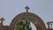 Ostrog, Montenegro - 30 June, 2017. Arch entrance to Ostrog monastery in mountains Montenegro. Zoom out motion cross at