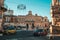 Ostuni\\\'s Historic Center Beautiful Piazza with Parasols and Stunning City Hall View Against Clear Blue Sky