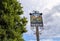 The Otford village sign in Otford, Kent, UK with tree