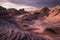 otherworldly desert landscape with strange rock formations, twisted sand dunes, and a purple-hued sky