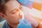 Otolaryngologist examines man`s nose with nasal dilator. Medical equipment