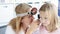 Otorhinolaryngologist doctor with frontal reflector examining little girl ear with otoscope 4k movie