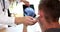 Otorhinolaryngologist examines patient using digital otoscope