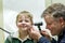 otoscope used in smiling boys ear