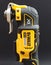 OTTERY ST MARY, DEVON - FEBRUARY 6TH 2020: Dewalt Cordless Multi Tool stands upright on its battery on a black background