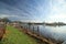 Oude Veerstal along the quay of river Hollandsche IJssel with windmill \'t Slot in Gouda, the Netherlands.