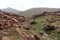 Oukaimeden, shepherds\\\' huts among mountains and green plains in autumn, Morocco