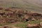 Oukaimeden, shepherds\\\' huts among mountains and green plains in autumn, Morocco