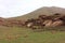 Oukaimeden, shepherds\\\' huts among mountains and green plains in autumn, Morocco