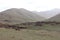 Oukaimeden, shepherds\\\' huts among mountains and green plains in autumn, Morocco