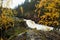 Oulanka National Park. Autumn foliage next to KiutakÃ¶ngÃ¤s waterfall and rapids in Northern Finland.