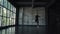 Oung male ballet dancer dancing classical ballet in studio on a dark background. slow motion