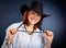 Oung woman in dark cowboy hat