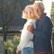 Ð¡ouple of grandparents embracing. Portrait of a beautiful elderly couple outdoors