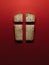 Our daily bread, a metaphor. Cross, Christian values, Christian religion concept. Bread in the form of a cross on a red background