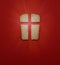 Our daily bread, a metaphor and sign. Cross, Christian values, Christian religion concept. Bread in the form of a cross on a red b