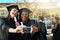 Our dreams came true. two young women taking selfies with a mobile phone on graduation day.