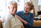 Our marriage just keeps getting better and better. Portrait of a senior couple relaxing together on the sofa at home.