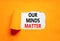 Our minds matter ourmindsmatter symbol. Concept words Our minds matter on beautiful white paper. Beautiful orange background. Our