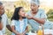 Our most basic instinct is family. a senior woman feeding her grand daughter some watermelon at a picnic.