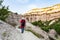 Ourist on rock slope in gorge near Goreme town