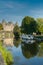 The Oust River canal and houseboats and Chateau Josselin castle