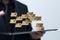 Out of focus businessman holding a tablet with floating 3D rendered golden envelopes above