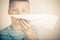 Out of focus child holding paper airplane
