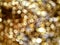 Out of Focus, Defocused, Blurred, Abstract and Bokeh of Sparkling Gold Lights, Suitable for Background Use