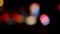 Out of focus defocused blurred bokeh of cars and traffic lights at night on city street.