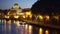 Out of focus Sant Angelo Bridge across Tiber River and San Pietro Basilica