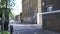 Out of focus shot of street scene in Bethnal Green area, graffiti tagged on wall