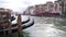 Out of focus view of old buildings on Grand Canal in Venice with gondolas