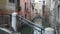 Out of focus view of old homes and gondolas in narrow canal in Venice, Italy