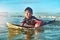 Out on a paddle adventure. Shot of a young boy out surfing.