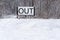 Out sign in snowy landscape, New Years Resolutions, self-improvement concept, lifestyle change, mind-body improvement