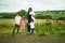 Out for some family fun. Portrait of a mother and her four little children bonding together outdoors.