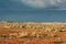 Outback landscape in South Australia with flat red ground with gravel and rocks