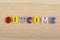 OUTCOME word on wooden background composed from colorful abc alphabet block wooden letters, copy space for ad text
