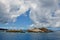 Outcropping rock on a sunny day with clouds