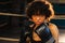 Outcry independent girl power. Angry african american woman fighter with boxing gloves looking serious aggressive