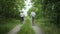 Outdoor activities, cheerful elderly couple having fun cycling through countryside