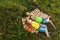 Outdoor activity. Young child boys eat just picking apples and lie on a plaid blanket. Brothers holding fresh organic