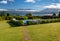 Outdoor area with pool, lake view and green grass