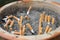 Outdoor ashtray with sand and cigarettes