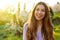 Outdoor atmospheric fashion photo of young beautiful lady in spring landscape