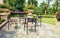 outdoor backyard patio in landscaping garden with furniture