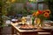 outdoor backyard table setting with grilled pizzas and drinks